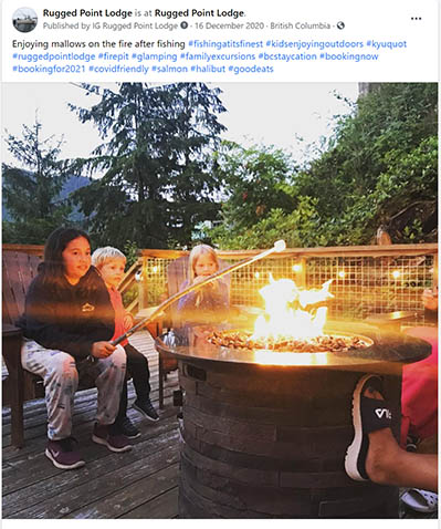 People relaxing around a fire